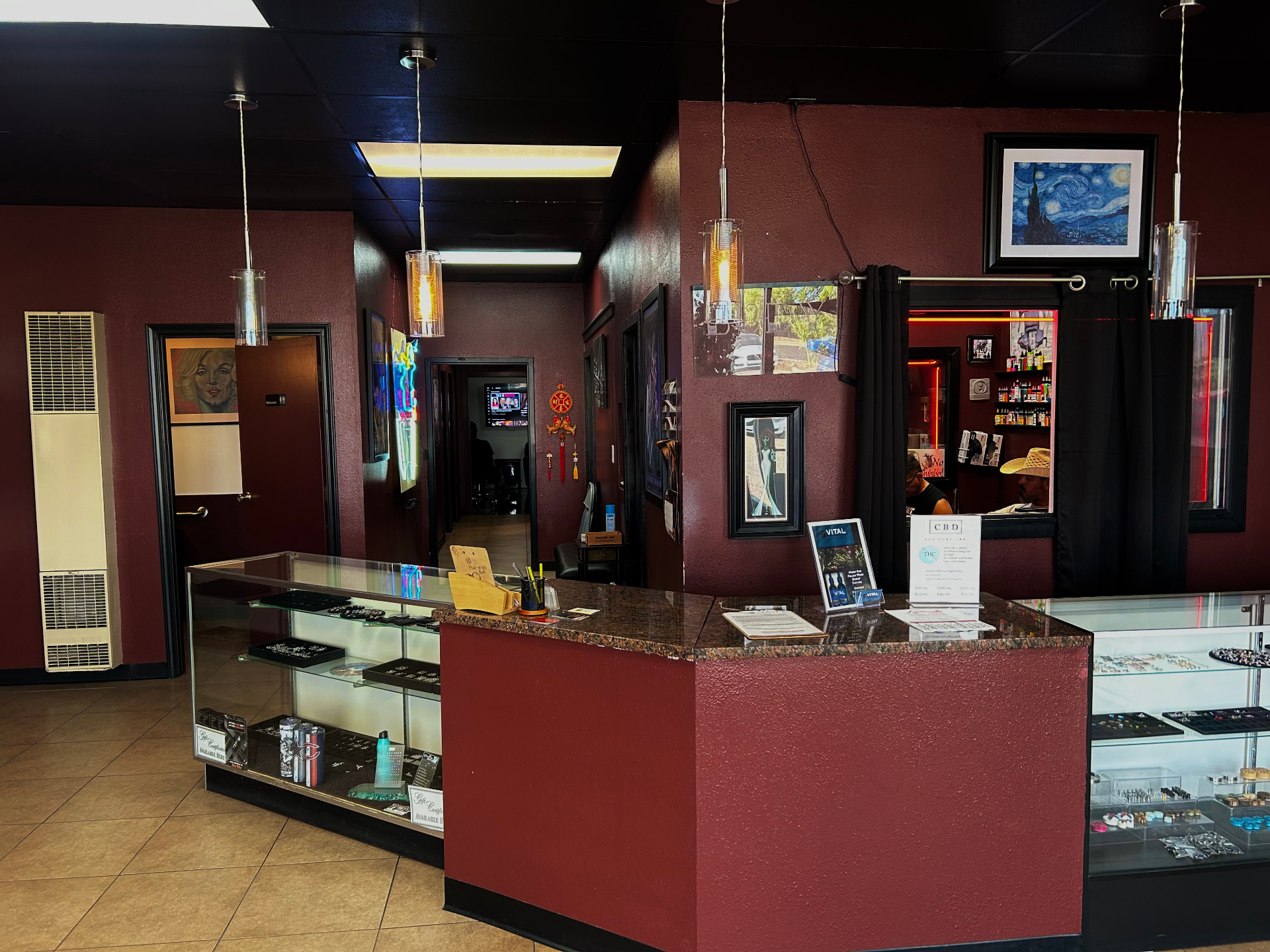 Valley Tattoo studio interior with jewelry display and gallery walls